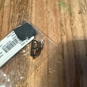 Gold letter “P” keep collective charm